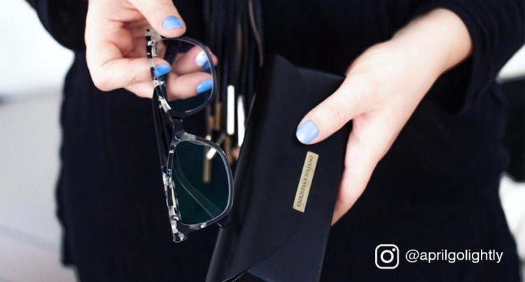 woman holding eyeglasses case